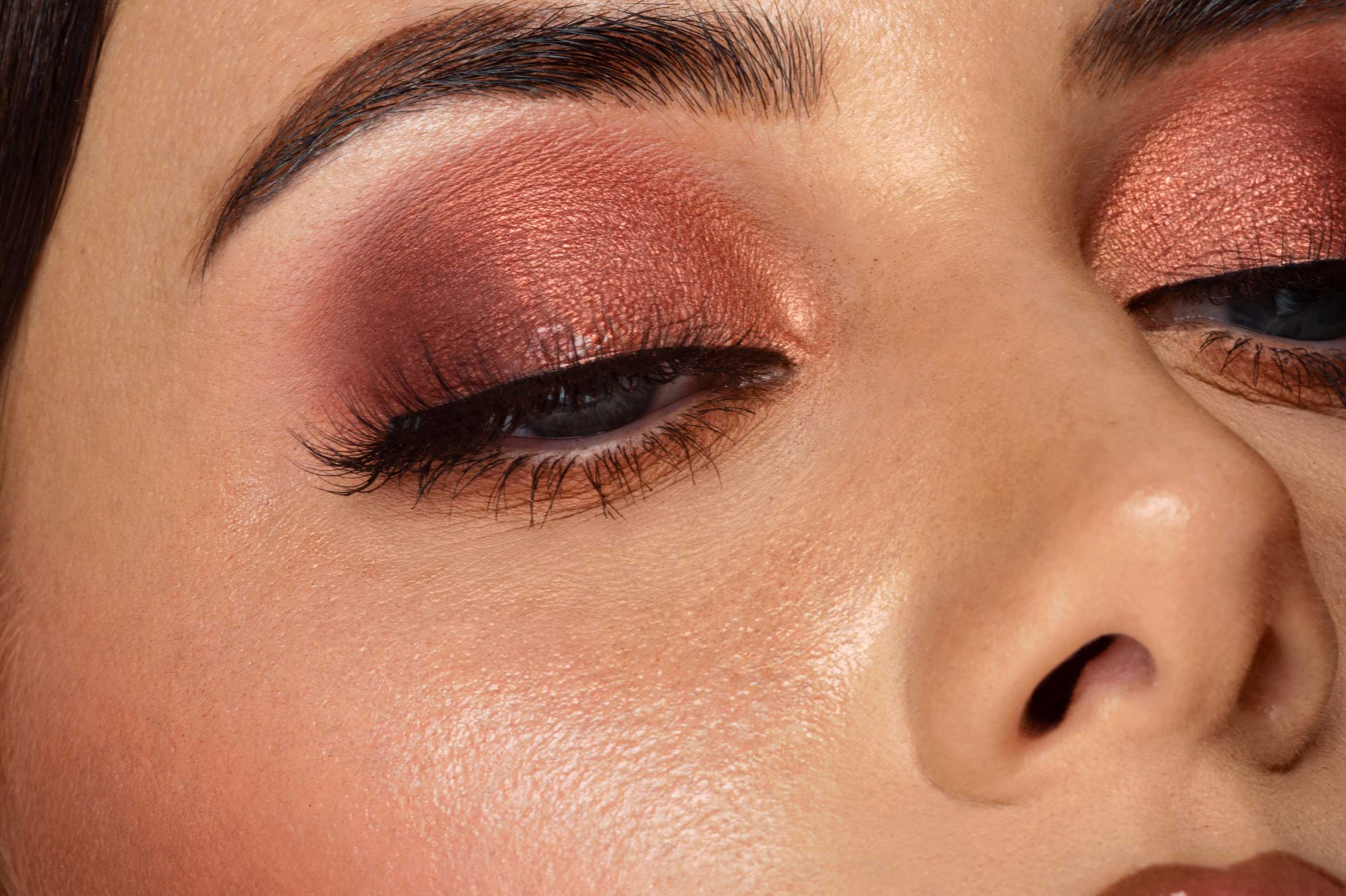 Model wears Bronze Lookbook eyeshadow palette using shade flare, sips tea and terracotta